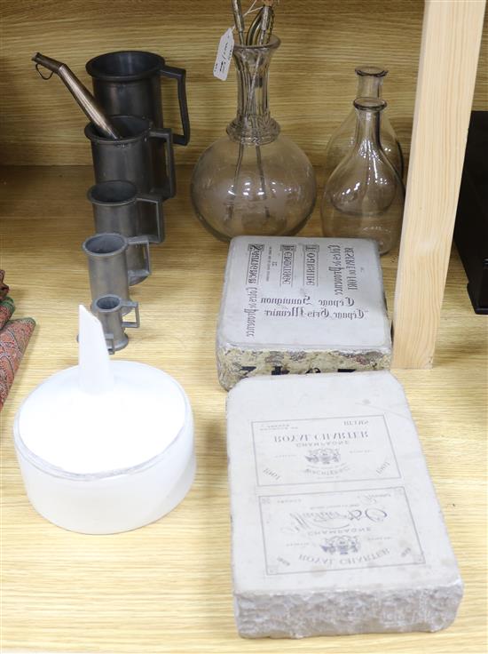 A group of assorted wine cellar related items including a set of seven French pewter measures, plated siphons,